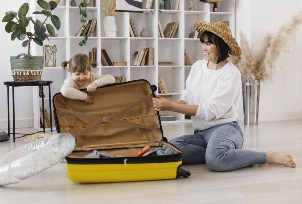 full-shot-woman-girl-with-luggage